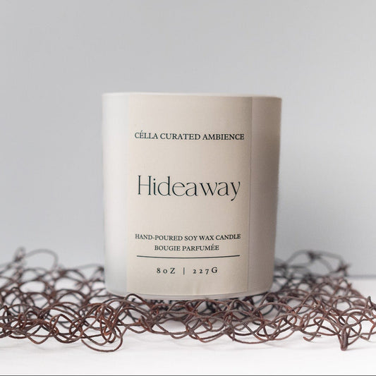 Célla Curated Ambience Hideaway scented candle in amber jar